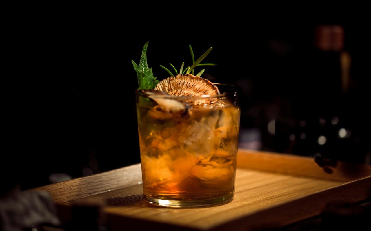 Sophisticated non-alcoholic cocktail served in elegant glassware with botanical garnish