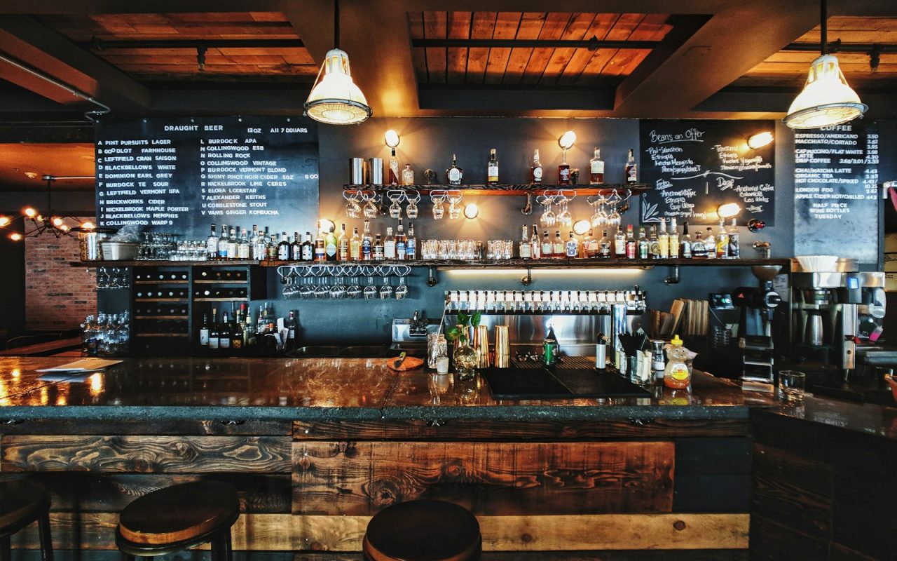 Cozy warm atmosphere in a traditional pub with people enjoying drinks and conversation